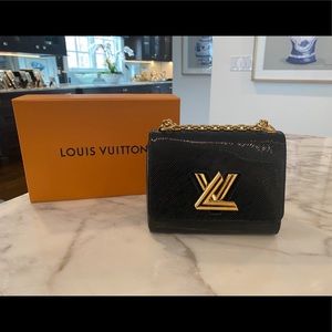 Louis Vuitton cowhide leather purse. Color black